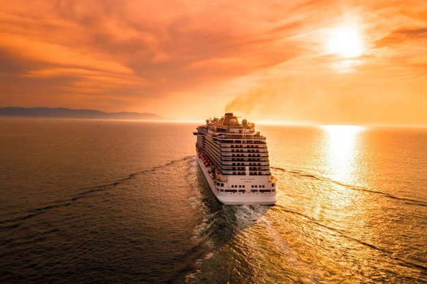 A picture of a cruise ship sailing at sunset, Royal Holiday Vacation Club offers cruise ships and resort vacations